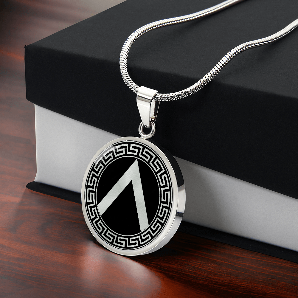 Spartan shield necklace featuring ancient Greek warrior shield artwork on a circular pendant with gift box