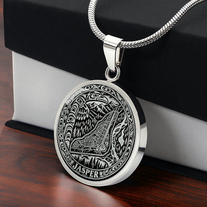 Silver Jasper Alberta necklace featuring stylized Jasper townsite map, Canadian Rocky Mountain peaks, pine forests and ornate circular border with gift box.