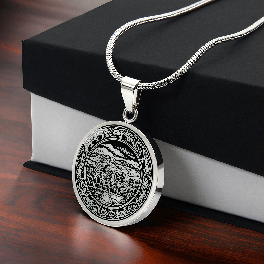 Silver Boise Idaho skyline necklace with downtown skyscrapers, mountain scenery, waterfront reflections and botanical circular border with gift box