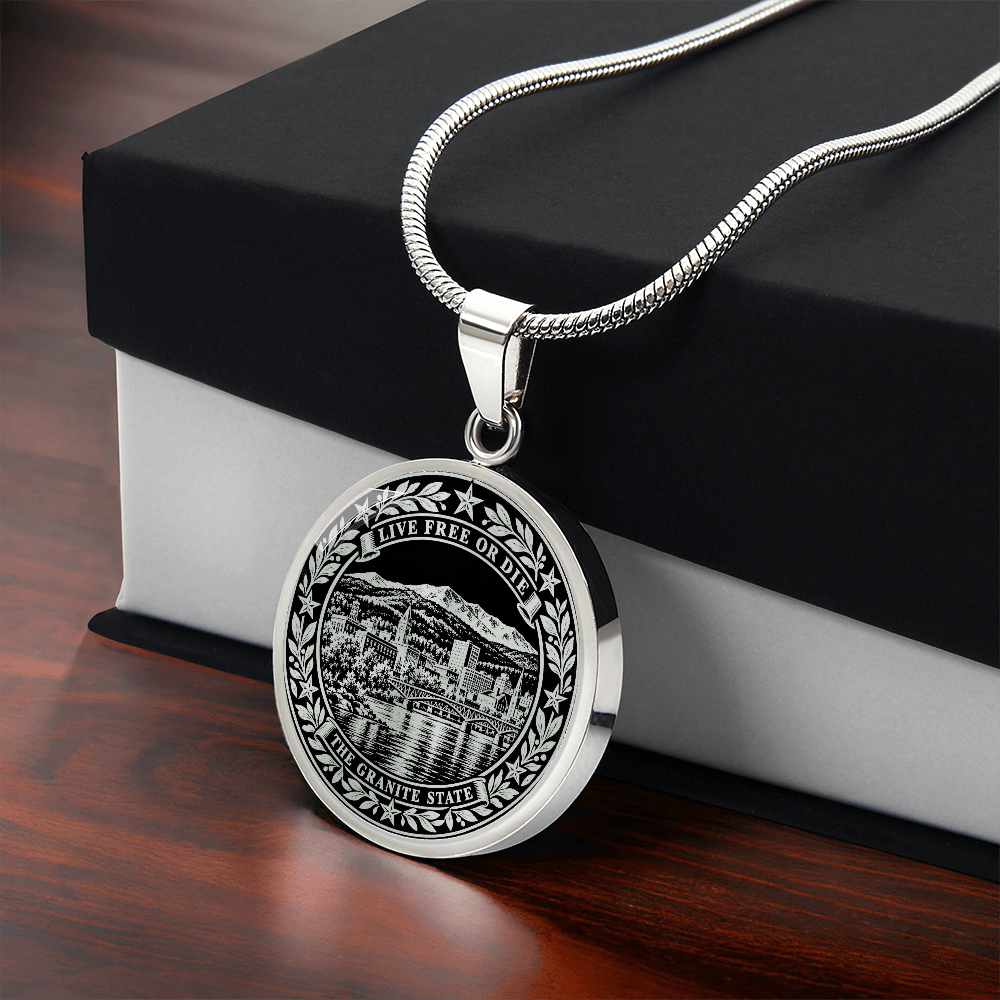 Silver New Hampshire necklace with mountain lake town, Live Free or Die motto and ornate Granite State border