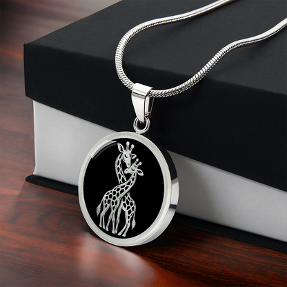 Two giraffes necklace featuring white-on-black illustration of giraffes standing together with their long necks gracefully intertwined.