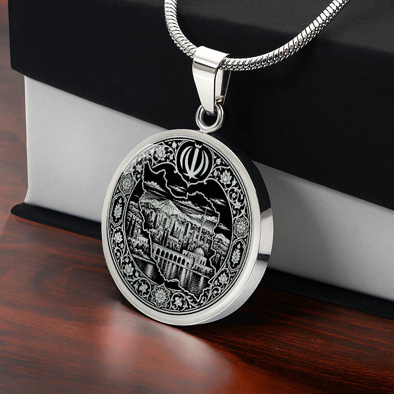 Iran map necklace in silver finish with black and white linocut artwork, Persian architecture, landscape and ornate floral border and black and white gift box.