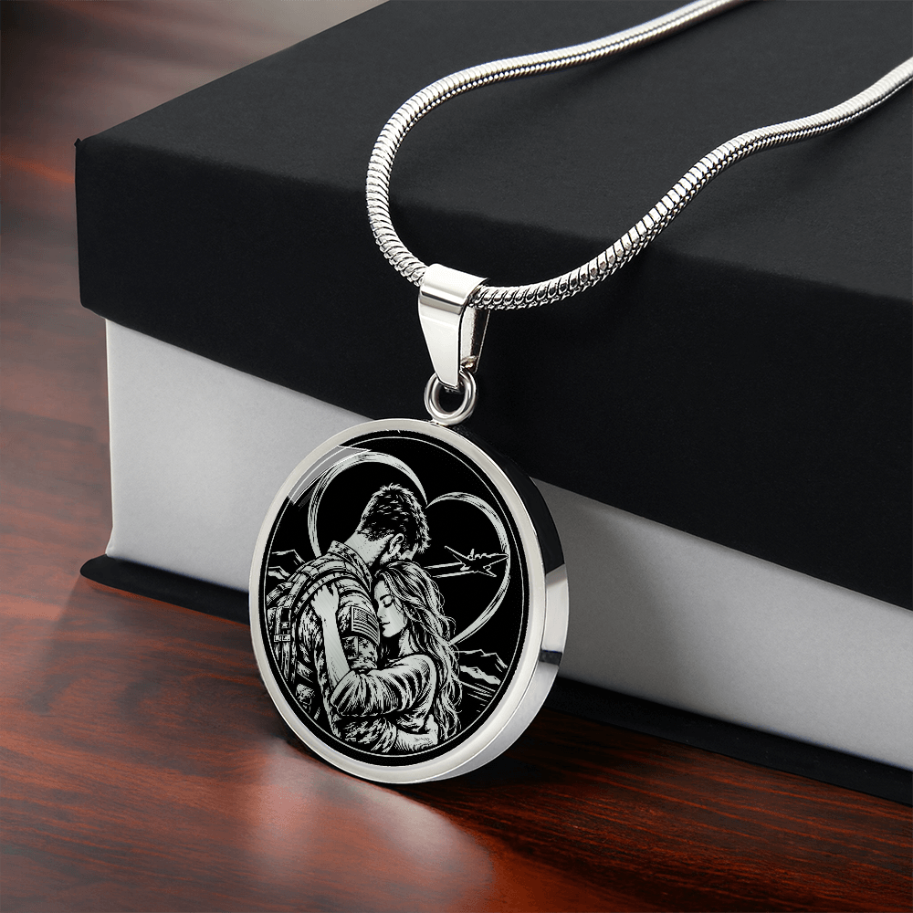 Silver military couple embrace necklace displayed against a black and white jewelry gift box.