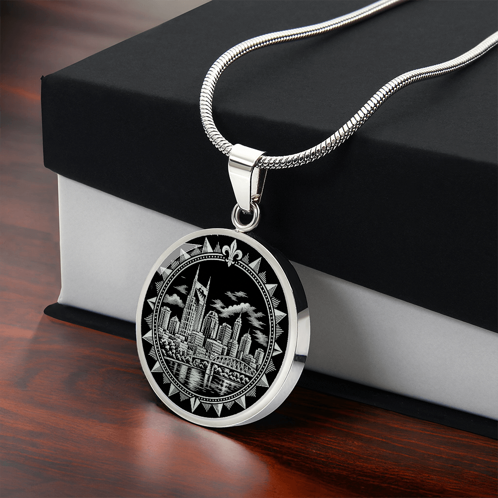 Silver Nashville skyline necklace with AT&T Building twin spires, Cumberland River bridge and decorative sunburst border with gift box