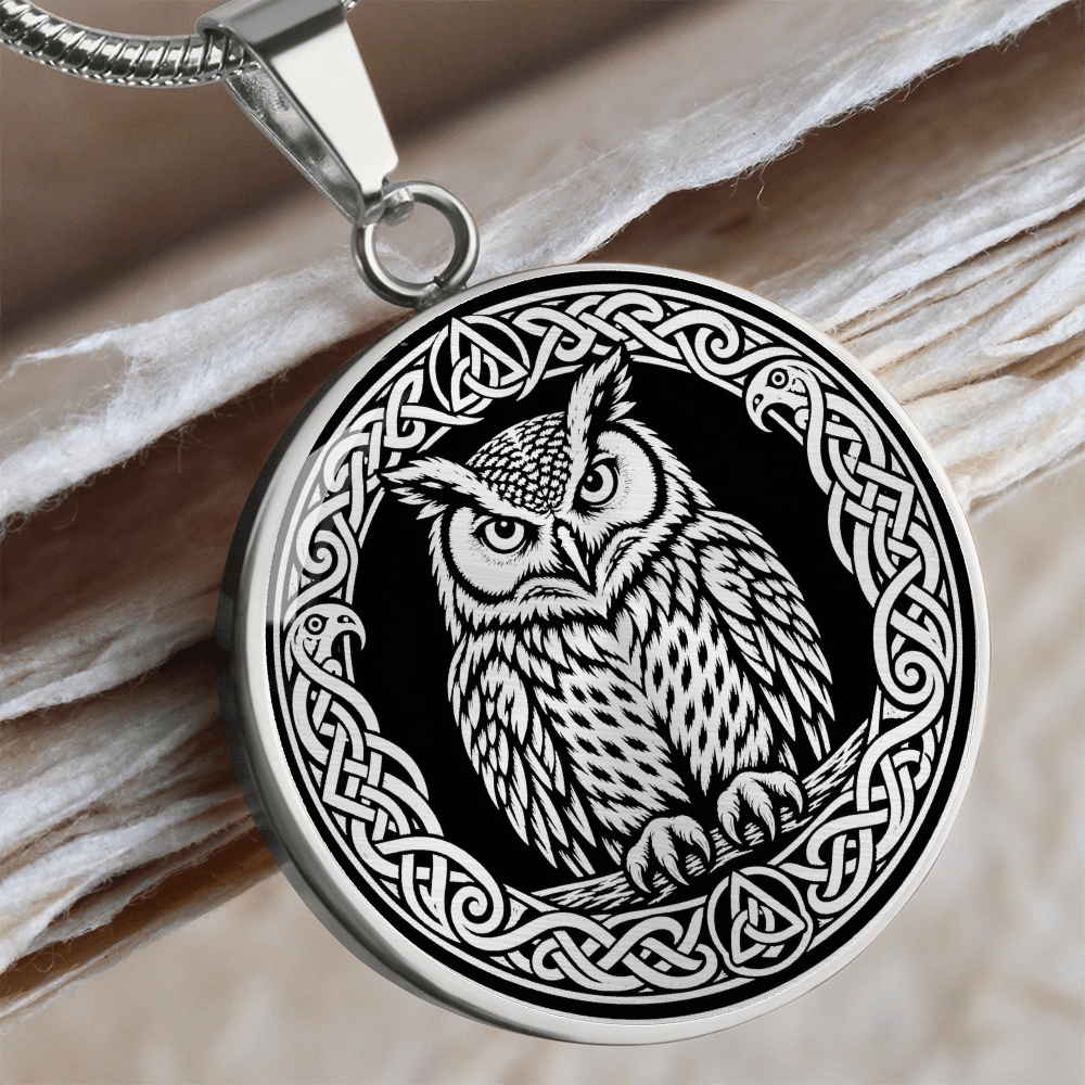 Close-up of Celtic owl pendant with bold linocut-style illustration