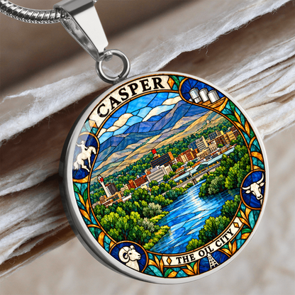 Silver Casper Wyoming necklace featuring stained-glass artwork of the city skyline, blue river, green trees, mountains and The Oil City lettering