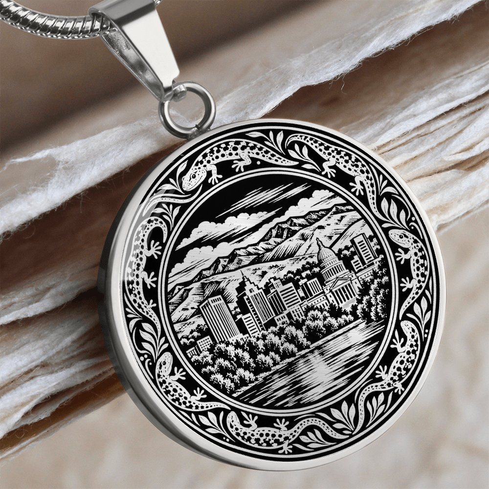 Silver Boise Idaho skyline necklace with mountain backdrop, downtown buildings, leafy trees and ornate botanical border