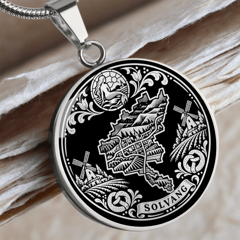 Silver Solvang California necklace with Danish windmills, traditional village buildings, ornamental flowers and SOLVANG inscription