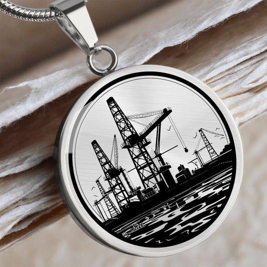 Oil rig necklace featuring drilling rig artwork on a circular pendant, a jewelry gift for oilfield workers.