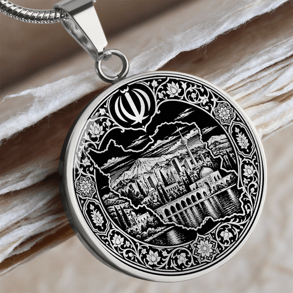 Iran map necklace in silver finish with black and white linocut artwork, Persian architecture, landscape and ornate floral border