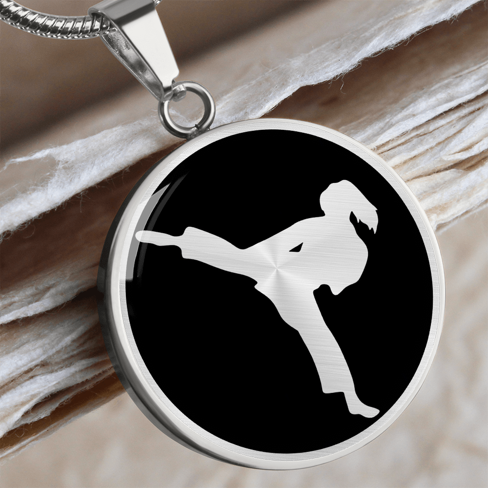 Silver finish karate girl necklace featuring female karate practitioner artwork on a circular pendant.