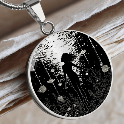 Scuba diving necklace featuring female diver artwork on a circular pendant, a jewelry gift for women who love diving.