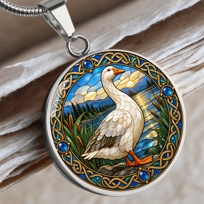 Close-up of goose bird necklace featuring decorative glass-style artwork