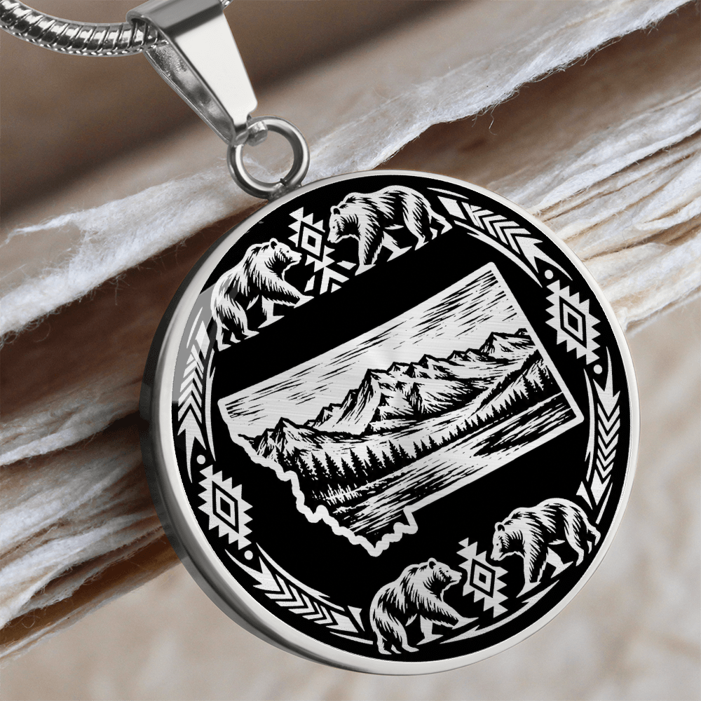 Silver Montana bear necklace featuring state outline with mountain scenery, four bears and decorative wilderness border