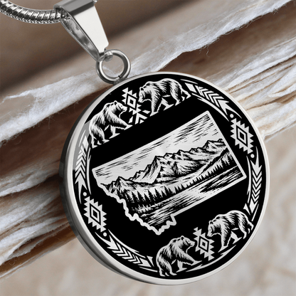 Silver Montana bear necklace featuring state outline with mountain scenery, four bears and decorative wilderness border