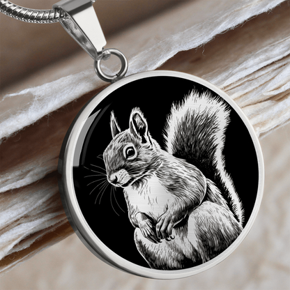Silver squirrel necklace featuring detailed white-and-grey squirrel artwork with a large bushy tail on a black circular pendant.