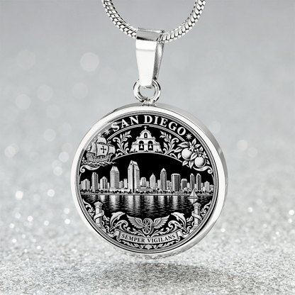 silver finish San Diego skyline pendant with waterfront buildings, black and gold artwork and ornate city emblem border
