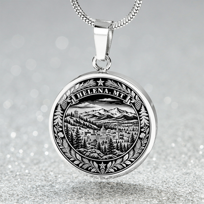 Silver Helena Montana necklace with mountain backdrop, historic city buildings, evergreen forest and pinecone wreath border