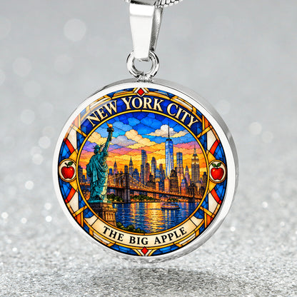 New York City skyline necklace in silver finish with Manhattan skyscrapers, One World Trade Center, Brooklyn Bridge and colorful sunset