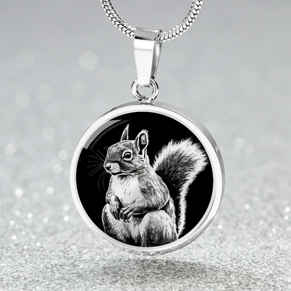 silver finish squirrel necklace featuring a silver-toned squirrel illustration with bushy tail against a black circular background.