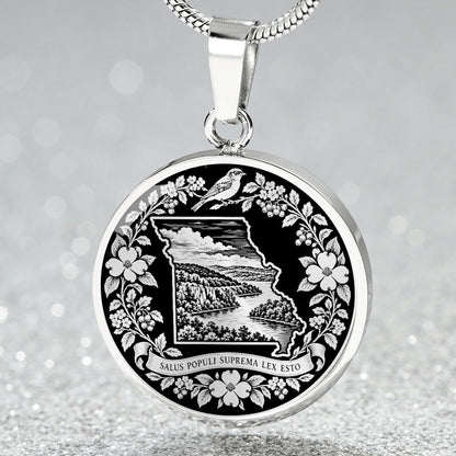 Silver Missouri State necklace with Missouri outline, Ozark mountain scenery, Eastern bluebird-inspired bird, dogwood flowers and Latin motto