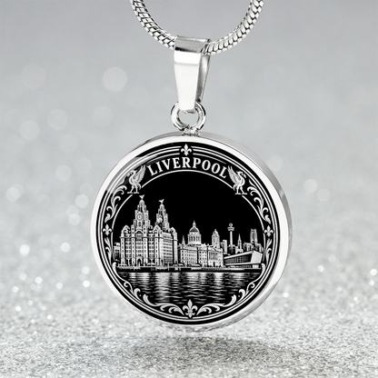 Silver Liverpool skyline necklace featuring the Royal Liver Building, historic waterfront architecture, river reflections and decorative floral border