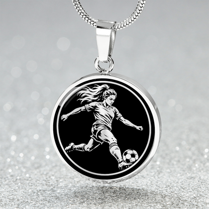 Silver-tone round soccer pendant featuring a female footballer kicking a ball