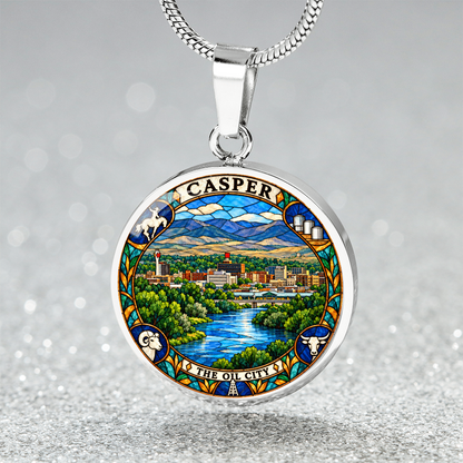 Silver Casper Wyoming necklace featuring stained-glass artwork of the city skyline, blue river, green trees, mountains and The Oil City lettering