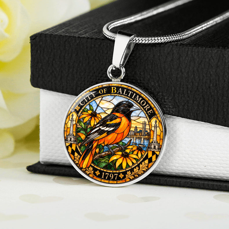 Silver Baltimore Oriole necklace with orange and black stained-glass bird, golden flowers, City of Baltimore lettering and 1797 inscription