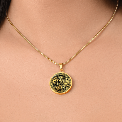 woman wearing a Gold plated Edmonton skyline necklace featuring downtown buildings, North Saskatchewan River bridge, radiant sun and floral border