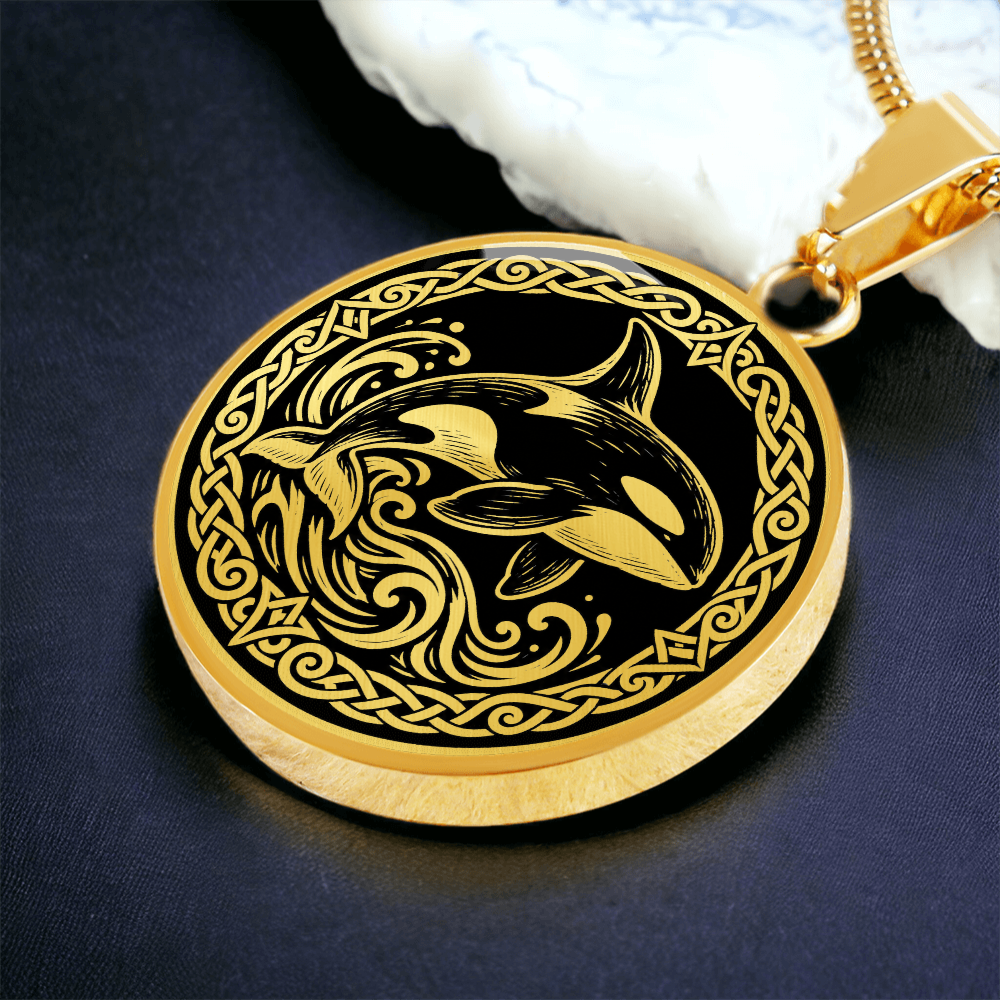 Gold finish orca necklace featuring killer whale linocut artwork and Nordic border