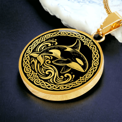 Gold finish orca necklace featuring killer whale linocut artwork and Nordic border