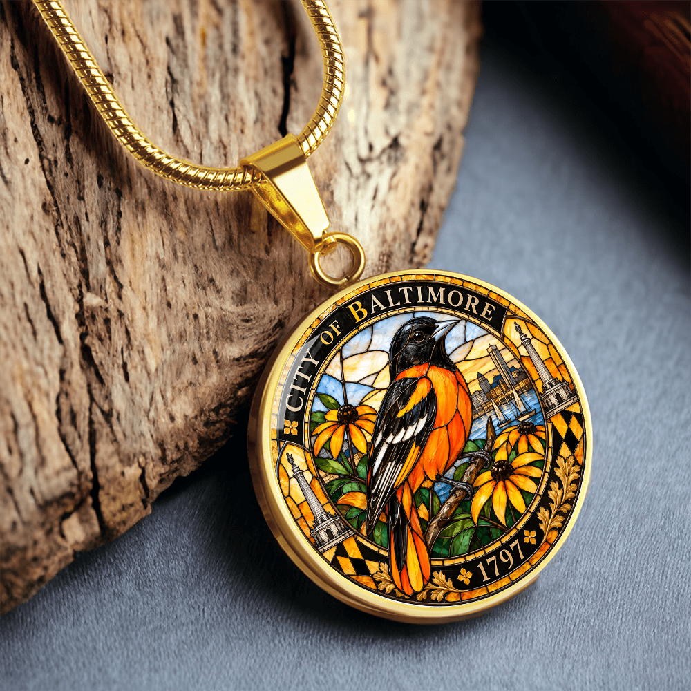 Gold Baltimore Oriole stained glass pendant necklace on silver chain with colorful bird, floral design and Baltimore city heritage border