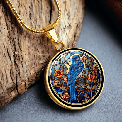Blue Jay necklace featuring colorful cloisonné-inspired bird artwork on a round pendant, a thoughtful gift for bird lovers.