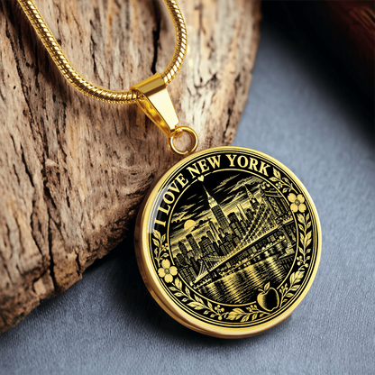 Gold finish New York City linocut necklace featuring vintage Manhattan skyscrapers, Brooklyn Bridge and decorative apple artwork