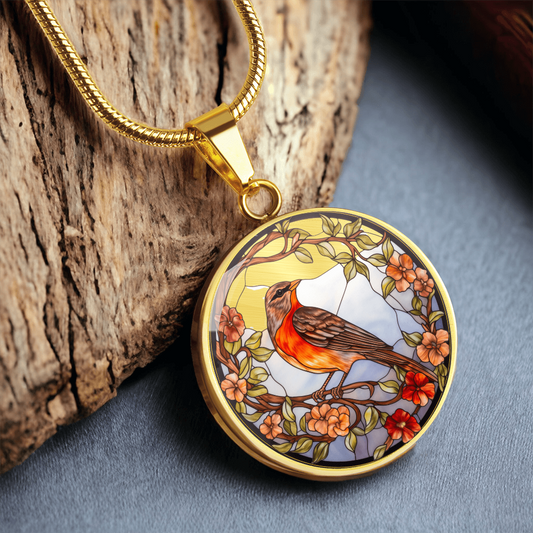 Stained-glass-inspired robin necklace featuring an orange-breasted bird perched among peach and red flowers on a round pendant.