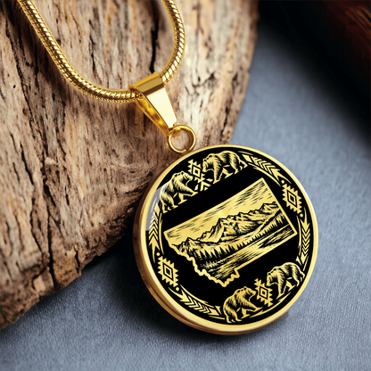 Gold finish Montana bear pendant with mountain landscape inside Montana state silhouette and four wildlife bear illustrations