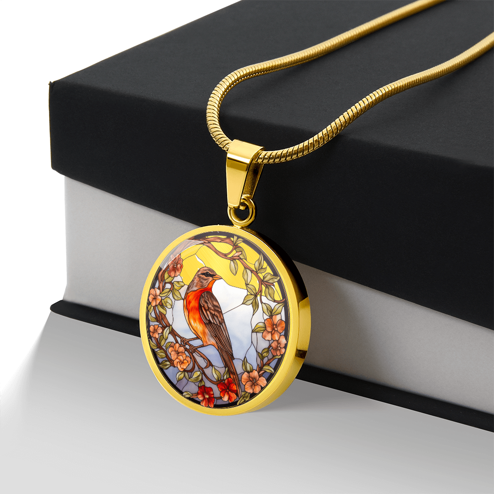 Stained-glass-inspired robin necklace featuring an orange-breasted bird perched among peach and red flowers on a round pendant with gift box.