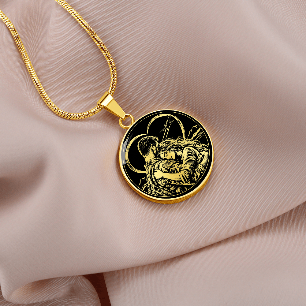 Gold finish military couple necklace worn around the neck over a black top, with a small circular romantic pendant.
