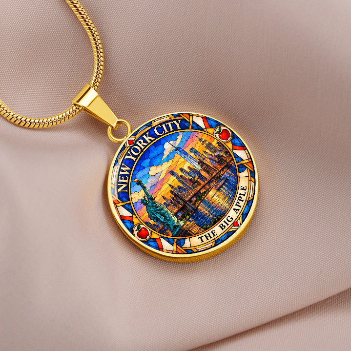 Gold finish NYC skyline pendant necklace with stained glass Manhattan buildings, Statue of Liberty, waterfront and The Big Apple lettering