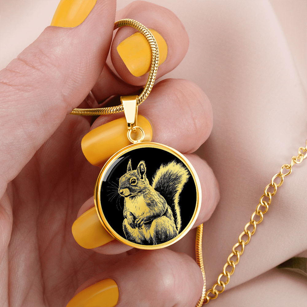 Squirrel pendant necklace featuring a detailed squirrel with a bushy tail against black, available in silver and gold finishes.