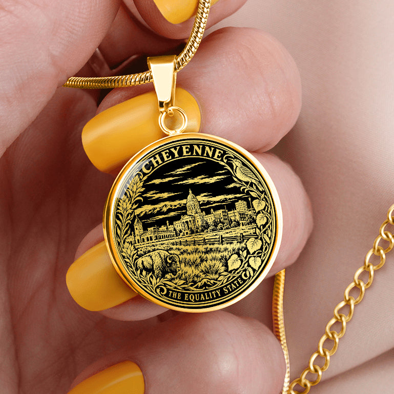 Gold finish Cheyenne Wyoming necklace with State Capitol illustration, bison, Western prairie scenery and ornamental flower border