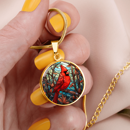 Stained glass-inspired cardinal necklace featuring a vivid red Northern Cardinal surrounded by colorful mosaic-style foliage on a round pendant.