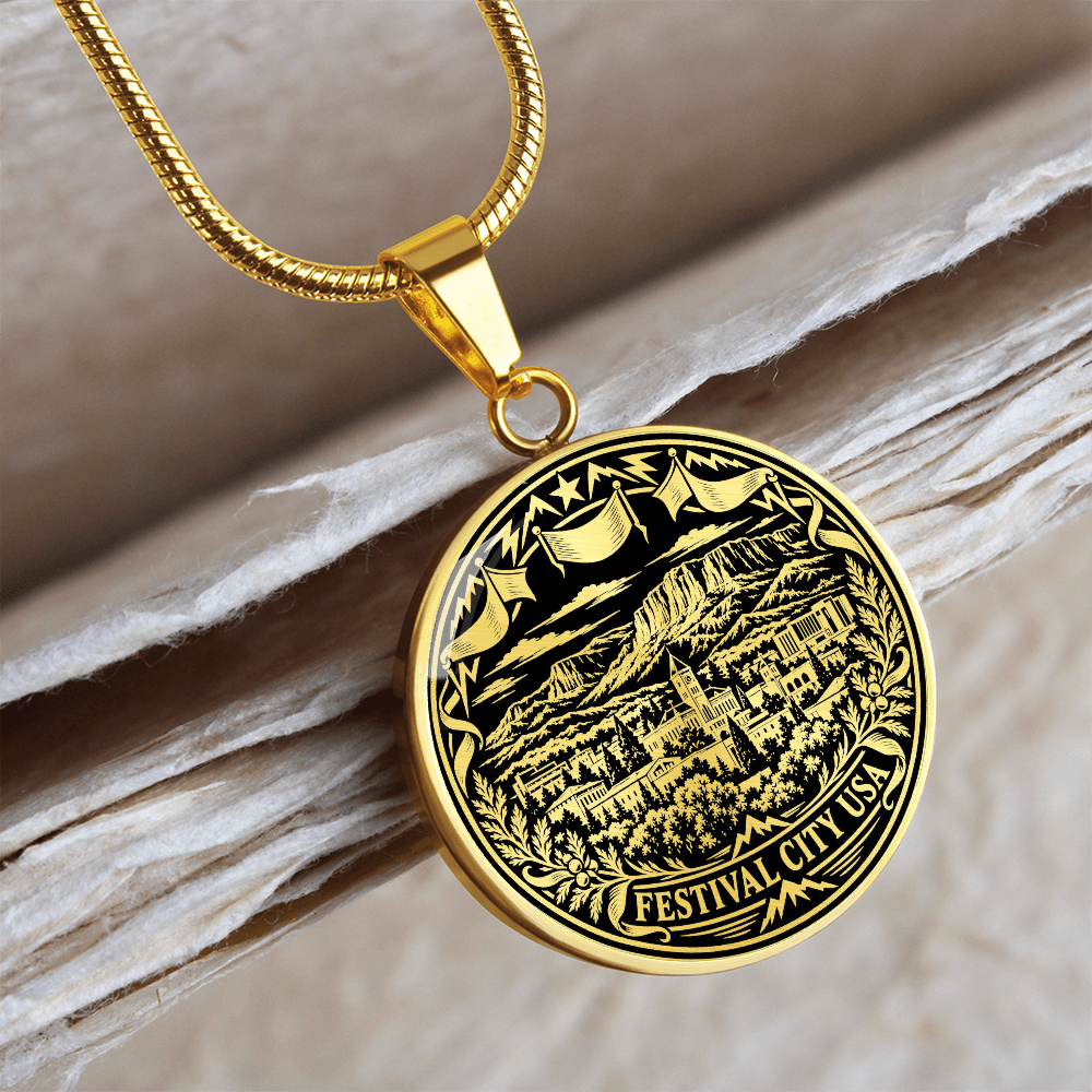 Gold finish Cedar City Utah pendant with mountain landscape, vintage buildings, festival flags and floral woodcut border