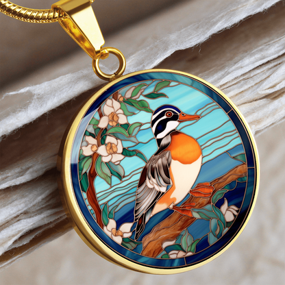 Gold Mandarin duck-inspired necklace featuring a colorful duck perched on a flowering branch against a turquoise-blue stained-glass-style background.