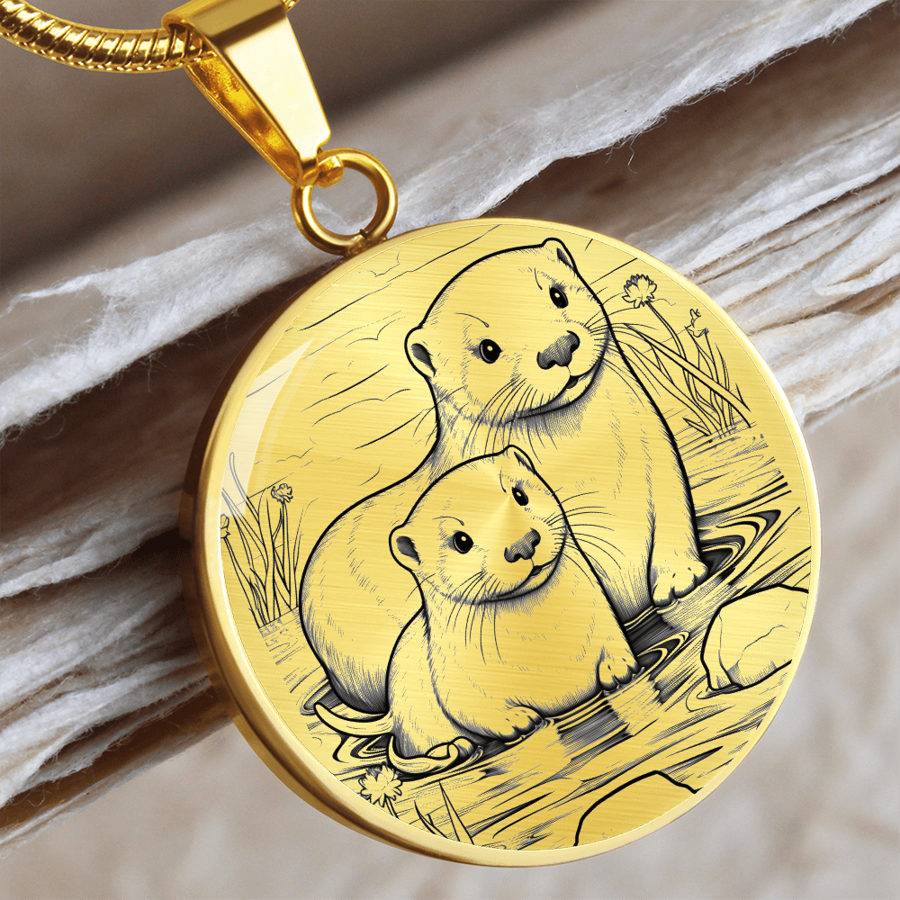 Gold Sea Otter Couple Necklace featuring two otters together in a delicate black-and-white shoreline illustration on a silver-colored pendant.