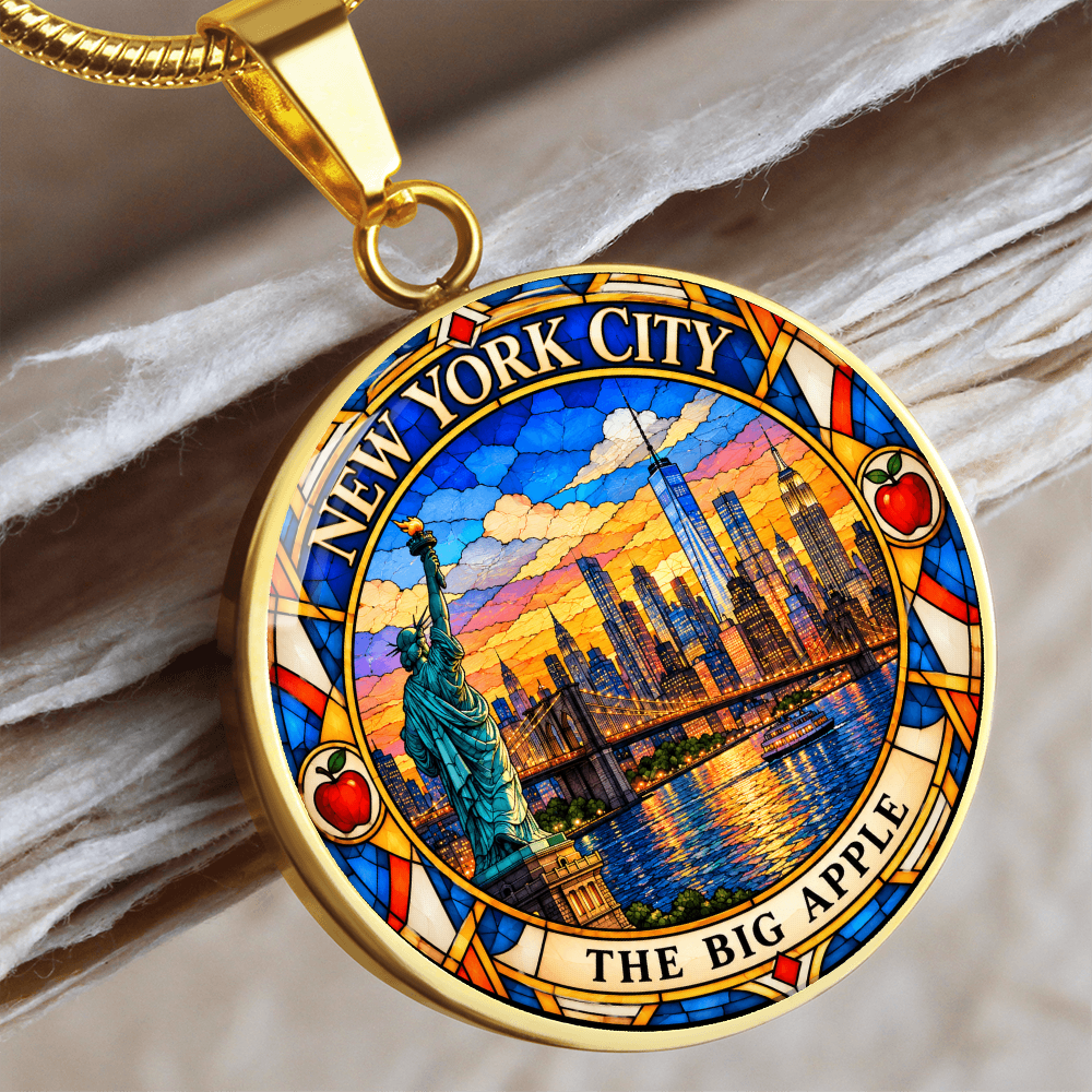 Gold finish NYC skyline pendant necklace with stained glass Manhattan buildings, Statue of Liberty, waterfront and The Big Apple lettering