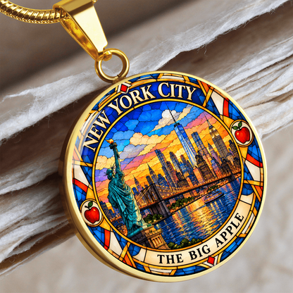 Gold finish NYC skyline pendant necklace with stained glass Manhattan buildings, Statue of Liberty, waterfront and The Big Apple lettering