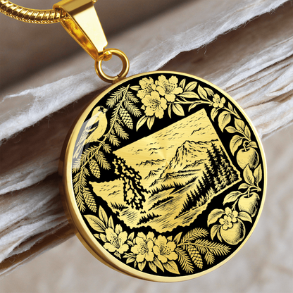 Gold finish Washington State mountain necklace with evergreen forest, bird, rhododendron-inspired flowers and ornate botanical design