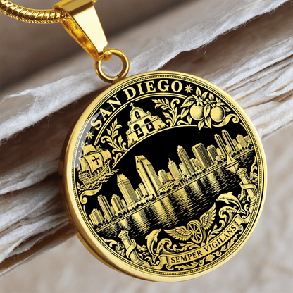 Gold finish San Diego skyline pendant with waterfront buildings, black and gold artwork and ornate city emblem border